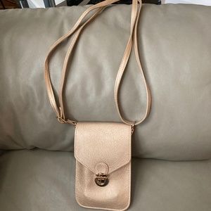 Gold Savethegirls purse with clear phone compartment